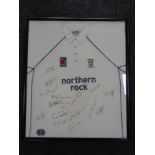 A framed Durham County Cricket Club t-shirt bearing various signatures