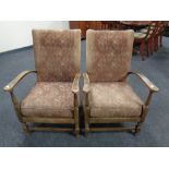 A pair of early 20th century beech framed armchairs