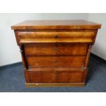 A 19th century Scandinavian satinwood four drawer chest with pillar column supports