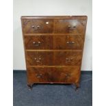 A 20th century walnut chest of four drawers