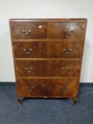 A 20th century walnut chest of four drawers