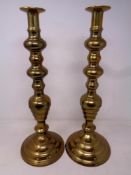 A pair of 19th century brass candlesticks, height 42 cm.