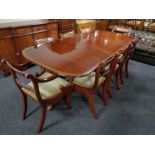 A Regency style twin pedestal extending dining table, with leaf,