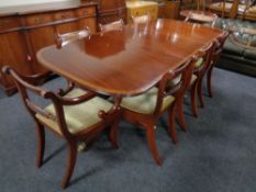 A Regency style twin pedestal extending dining table, with leaf,