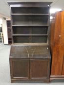 A 19th century bureau bookcase fitted with cupboards