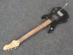 An Encore electric guitar.