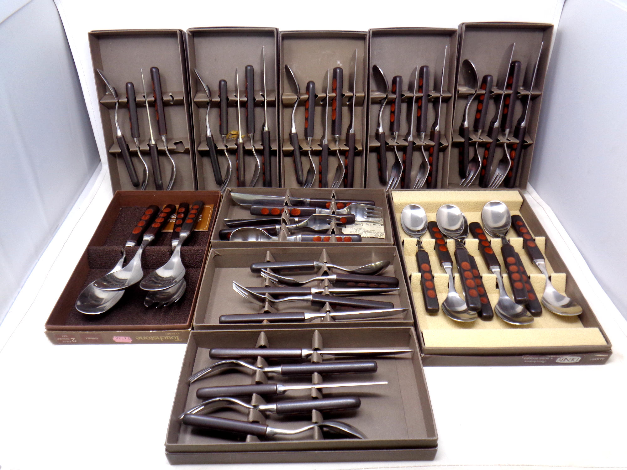 Approximately eleven stainless steel cutlery sets by Denby