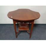 A shaped mahogany two tier occasional table