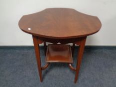 A shaped mahogany two tier occasional table