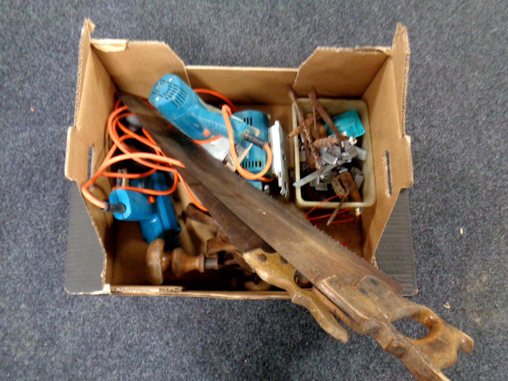 A box of vintage hand tools, power tools,