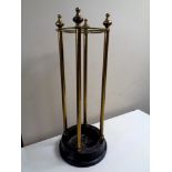 A brass stick stand on iron base, height 60 cm.