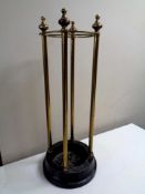 A brass stick stand on iron base, height 60 cm.
