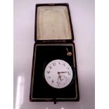 A vintage pocket watch face with winder in case