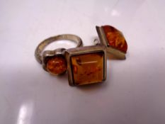A silver amber ring and earrings