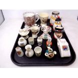 A tray of ceramics, Goss crested china, Doulton beafeater character jug, Goebel mug,