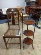 An Edwardian mahogany bergere seated chair together with three tier cake stand