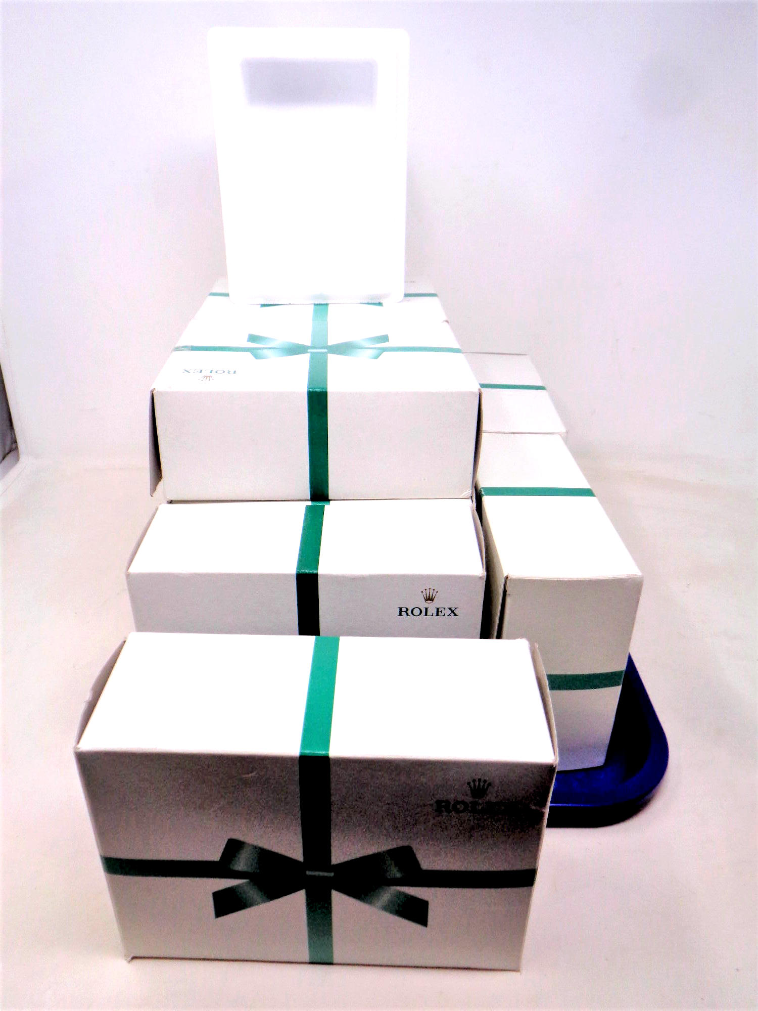 Ten Rolex display boxes with internal polystyrene box, both bearing Rolex branding.
