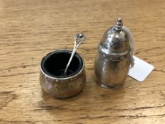 A silver sifter, Elkington & Co, together with a Lindisfarne silver salt with associated spoon.
