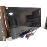 A Samsung 32 inch LCD TV with lead and remote,
