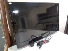 A Samsung 32 inch LCD TV with lead and remote,