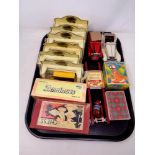 A tray of toys including six Ringtons die cast vehicles, dominoes, chess pieces, playing cards,