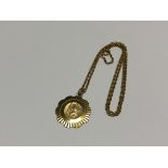 A 9ct gold St Christopher pendant on 9ct gold chain CONDITION REPORT: 7.