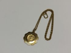 A 9ct gold St Christopher pendant on 9ct gold chain CONDITION REPORT: 7.