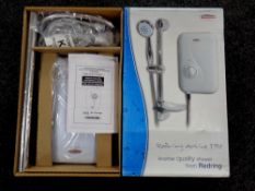 A Redring active 3505 electric shower, boxed.