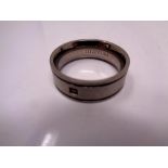 A titanium gent's band ring set with a stone