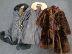 Two lady's three quarter length leather coats with faux fur trim together with faux fur coat