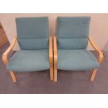 A pair of bentwood framed armchairs in turquoise fabric