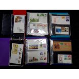 A box of five albums of first day covers