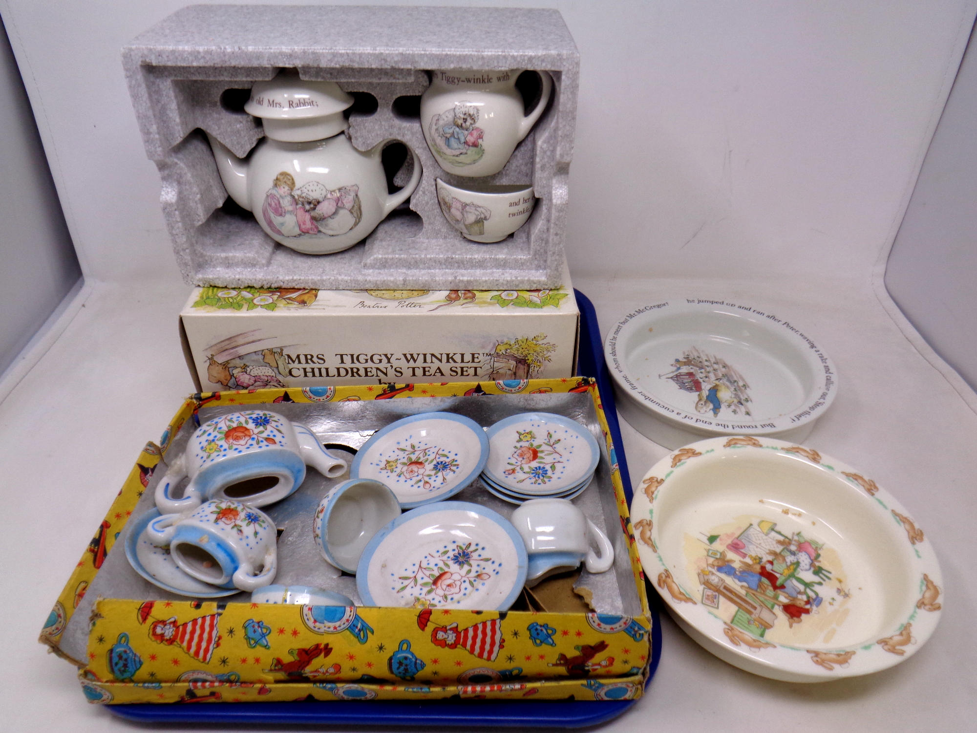 A Beatrix Potter Wedgwood child's tea set in box and a continental child's tea set