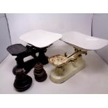 Two sets of antique enamelled kitchen scales and weights