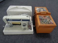 An Alfa De Luxe electric sewing machine in case together with concertina sewing box