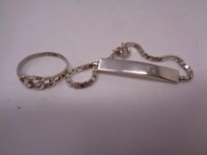 A child's silver ID bracelet and ring