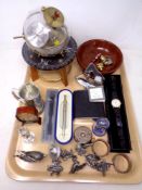 A tray of plated napkin rings, pewter figures, boxed pens, watch,