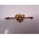 A 9ct gold sweetheart brooch