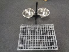 A folding metal pet cage together with a pet water bowl stand