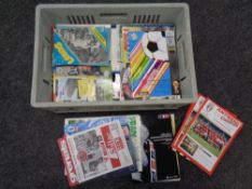 A crate of late 20th century football programmes,
