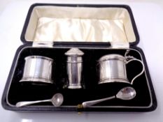 A silver three piece cruet set, Birmingham 1925, in original box with liners.