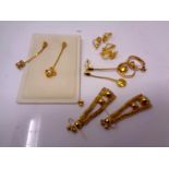 Five pairs of gold plated earrings