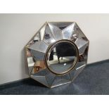 A contemporary octagonal glass wall mirror