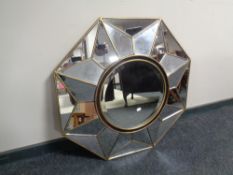 A contemporary octagonal glass wall mirror