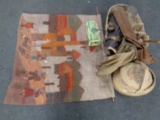 A wicker Moses basket, Henselite lawn bowls, vintage golf bags, carpet beaters, wall hanging,