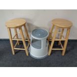 A pair of pine breakfast bar stools together with a circular stool set