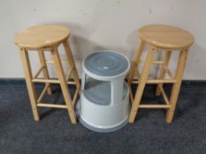 A pair of pine breakfast bar stools together with a circular stool set