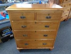 An Edwardian pine five drawer chest