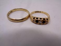 A lady's 18ct gold ring inset with five stones, 2.