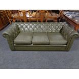 A Chesterfield three seater faux leather settee